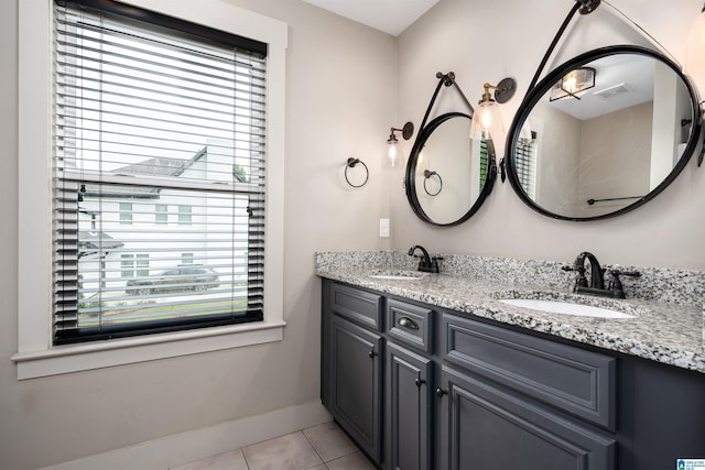 full bath with double vanity, visible vents, tile patterned floors, and a sink
