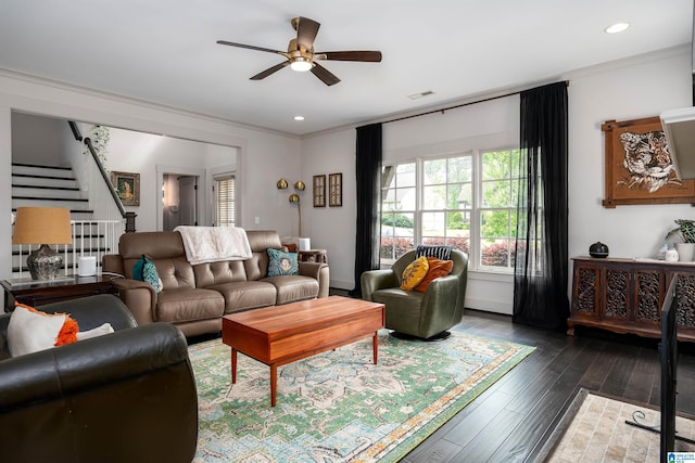 living room featuring stairway, a healthy amount of sunlight, a ceiling fan, and hardwood / wood-style flooring