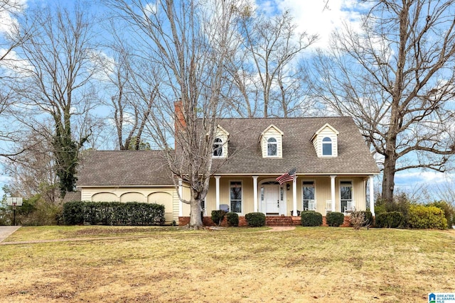 1938 Pleasant Ridge Loop, Sylacauga, AL 35150 - cape cod-style house with covered porch, a shingled roof, a chimney, and a front lawn