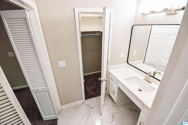 841 Olde Mill Trce, Cottondale, AL 35453 - bathroom featuring baseboards, vanity, marble look tiles, and a closet