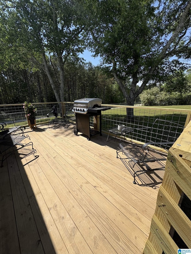wooden deck with grilling area