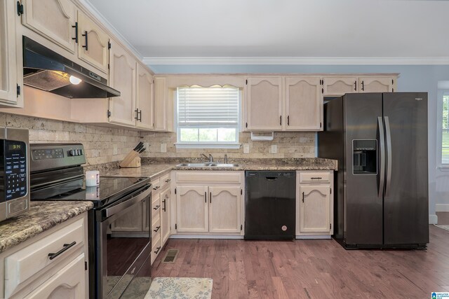 165 Ashford Ln, Alabaster, AL 35007 - kitchen featuring decorative backsplash, appliances with stainless steel finishes, a sink, ornamental molding, and under cabinet range hood