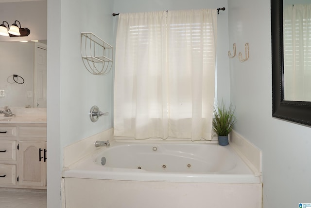 165 Ashford Ln, Alabaster, AL 35007 - bathroom featuring a jetted tub and vanity
