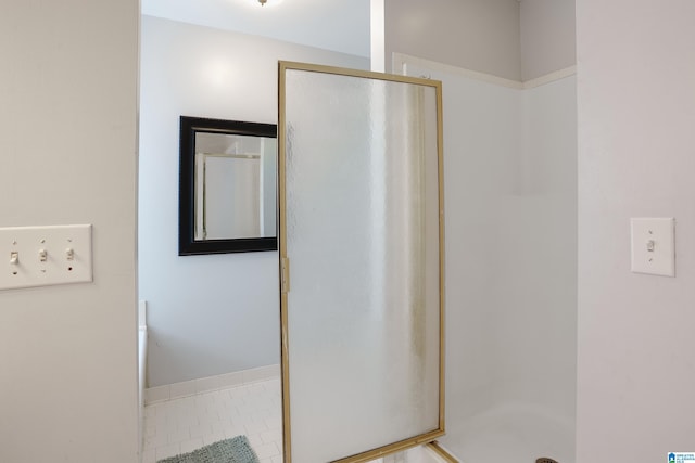 165 Ashford Ln, Alabaster, AL 35007 - bathroom featuring tile patterned floors and a shower stall