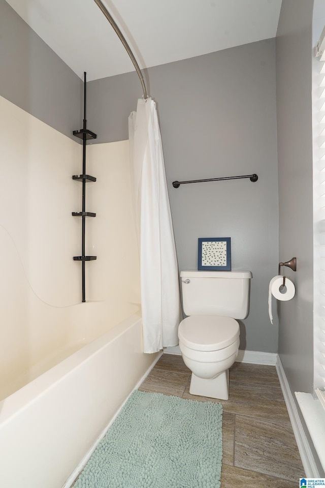 165 Ashford Ln, Alabaster, AL 35007 - full bathroom with baseboards, shower / tub combo with curtain, wood finished floors, and toilet