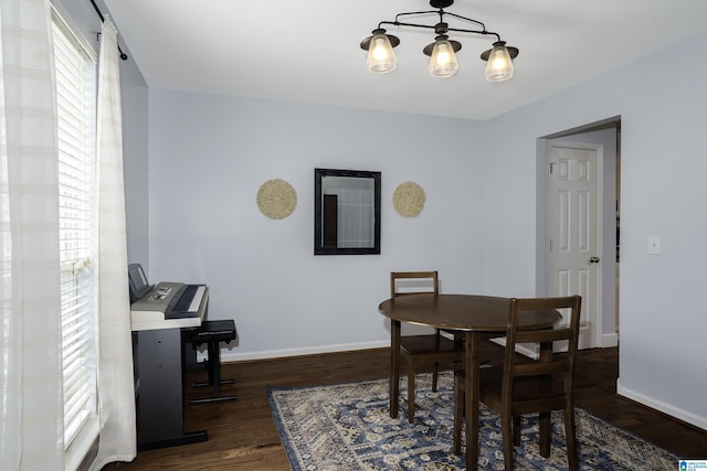 165 Ashford Ln, Alabaster, AL 35007 - dining room with baseboards, dark wood finished floors, and a chandelier