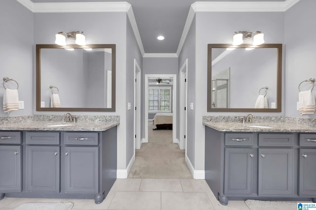 full bath with a sink, a shower stall, and baseboards
