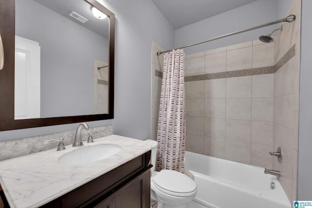 full bathroom featuring visible vents, shower / bath combination with curtain, toilet, and vanity