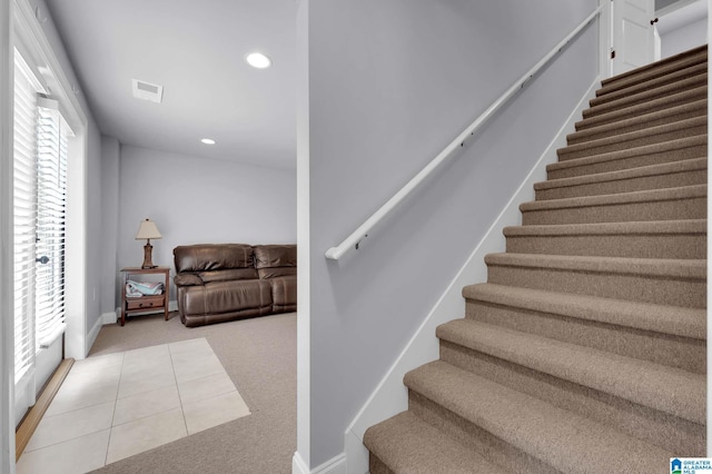 stairway featuring baseboards, visible vents, carpet floors, and recessed lighting
