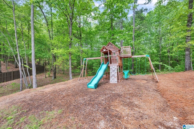 view of jungle gym with fence
