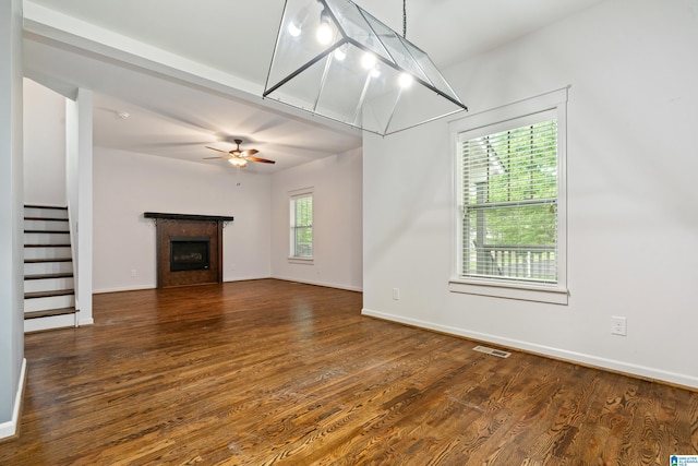 2607 Woodfern Ct, Homewood, AL 35209 - unfurnished living room featuring visible vents, stairs, wood finished floors, a fireplace, and a ceiling fan