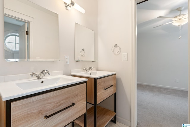 2607 Woodfern Ct, Homewood, AL 35209 - full bathroom with baseboards, a sink, ceiling fan, and two vanities