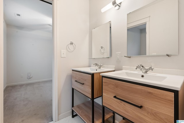 2607 Woodfern Ct, Homewood, AL 35209 - bathroom featuring a sink, baseboards, visible vents, and two vanities