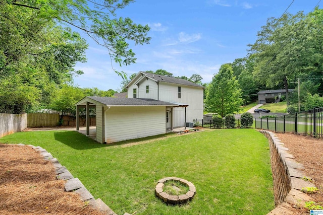 2607 Woodfern Ct, Homewood, AL 35209 - back of property with a lawn and a fenced backyard