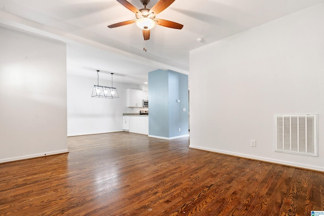 2607 Woodfern Ct, Homewood, AL 35209 - unfurnished living room featuring baseboards, ceiling fan, dark wood-style floors, and visible vents