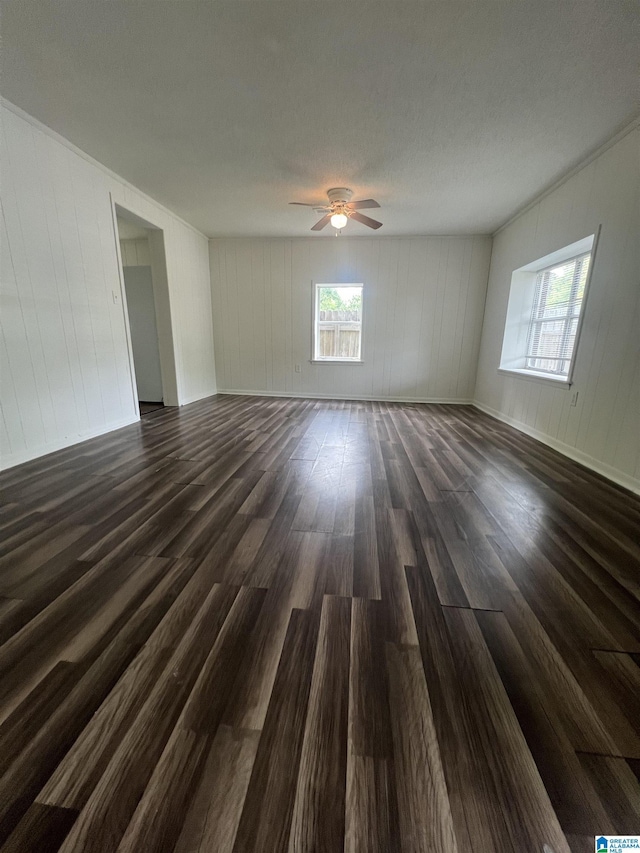 1701 Mount Pleasant Rd, Clanton, AL 35045 - unfurnished room with dark wood finished floors, baseboards, ceiling fan, and crown molding