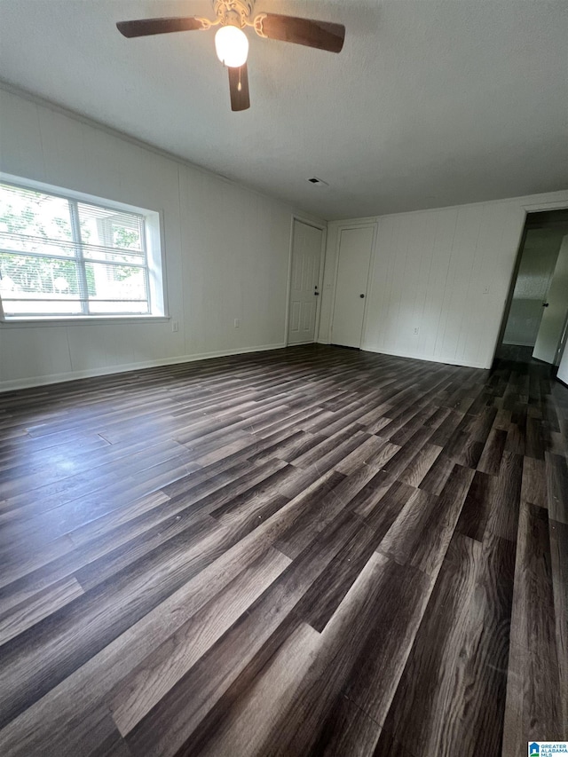 1701 Mount Pleasant Rd, Clanton, AL 35045 - unfurnished living room featuring a ceiling fan and dark wood-style floors