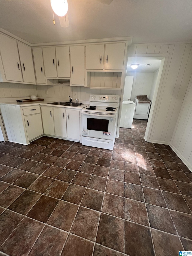 1701 Mount Pleasant Rd, Clanton, AL 35045 - kitchen featuring a sink, white range with electric stovetop, light countertops, white cabinetry, and washer / clothes dryer
