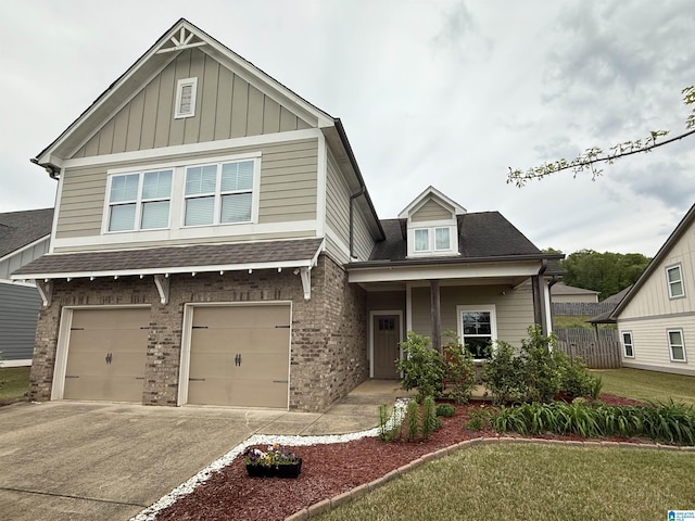 craftsman inspired home with an attached garage, board and batten siding, roof with shingles, and driveway