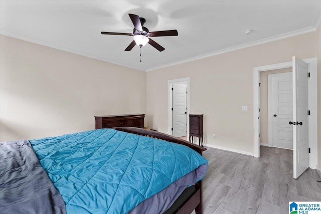 bedroom featuring crown molding, baseboards, a ceiling fan, and wood finished floors