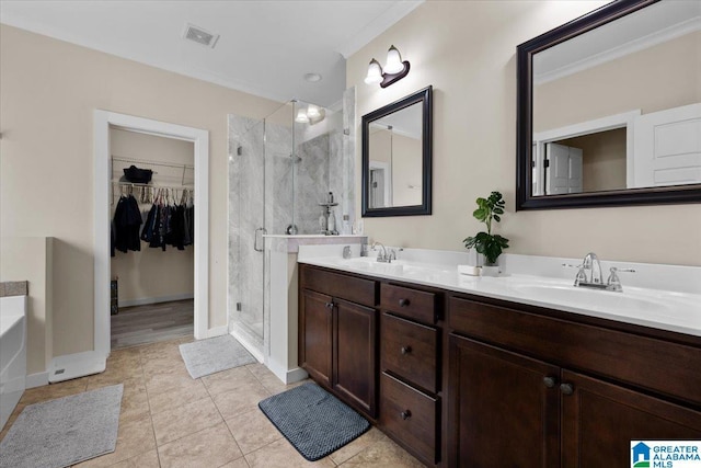 full bathroom with double vanity, visible vents, a shower stall, and a sink