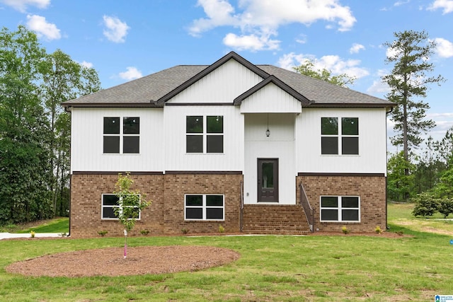670 Hillstone Dr, Pell City, AL 35125 - view of front of house featuring a front yard, roof with shingles, and brick siding