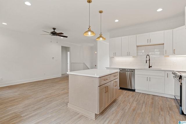 670 Hillstone Dr, Pell City, AL 35125 - kitchen featuring stainless steel dishwasher, range with electric stovetop, ceiling fan, a sink, and a center island