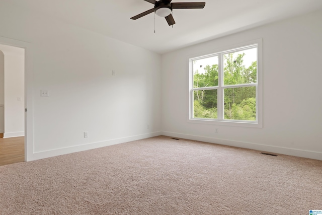 670 Hillstone Dr, Pell City, AL 35125 - spare room featuring baseboards, visible vents, ceiling fan, and light colored carpet