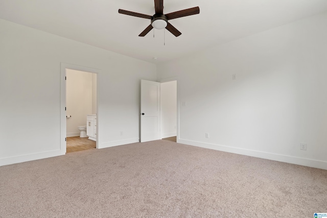 670 Hillstone Dr, Pell City, AL 35125 - unfurnished bedroom featuring baseboards, connected bathroom, and light colored carpet