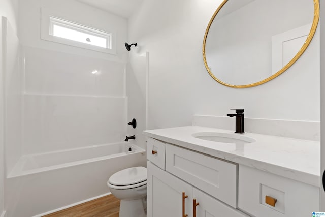 670 Hillstone Dr, Pell City, AL 35125 - bathroom featuring toilet, shower / washtub combination, wood finished floors, and vanity