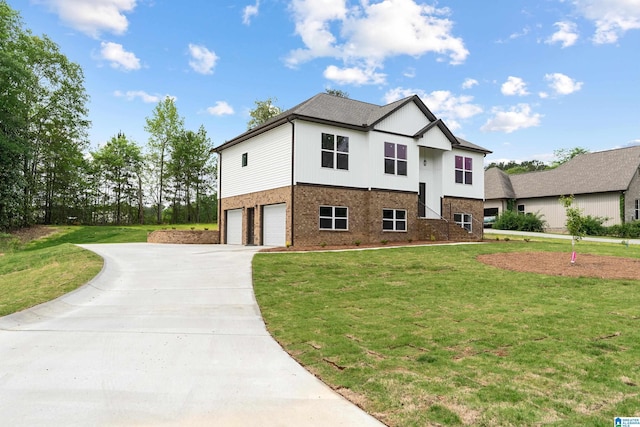 670 Hillstone Dr, Pell City, AL 35125 - view of front of property with a front lawn, driveway, an attached garage, and brick siding