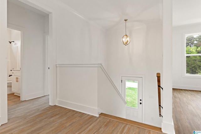 670 Hillstone Dr, Pell City, AL 35125 - entrance foyer featuring an inviting chandelier, wood finished floors, and baseboards