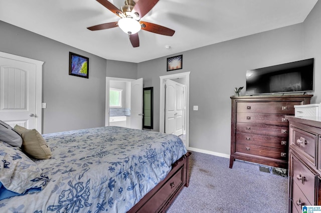 carpeted bedroom featuring ceiling fan, connected bathroom, and baseboards