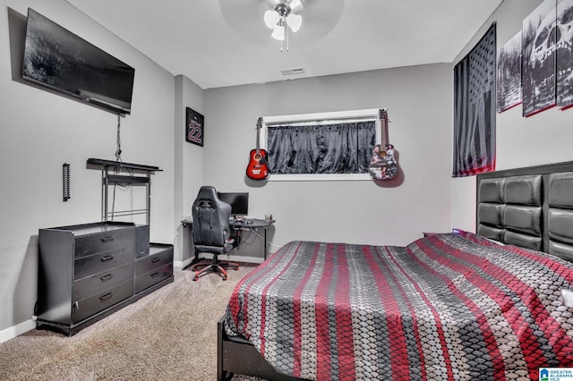 carpeted bedroom with ceiling fan, visible vents, and baseboards