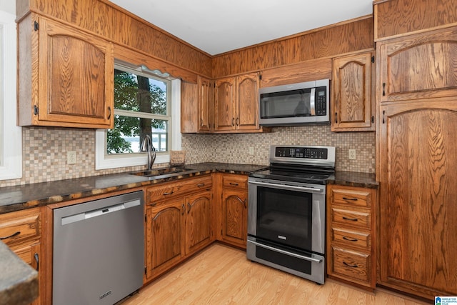 3516 Griffitt Bend Rd, Talladega, AL 35160 - kitchen with appliances with stainless steel finishes, a sink, dark countertops, and backsplash