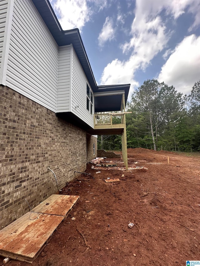 view of property exterior featuring brick siding