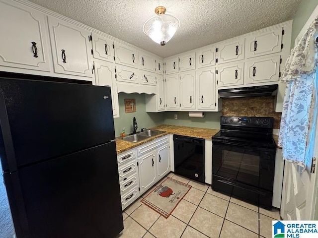 kitchen featuring a textured ceiling, white cabinets, a sink, under cabinet range hood, and black appliances