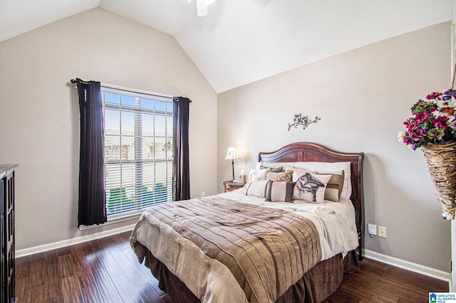 bedroom with baseboards, vaulted ceiling, and wood finished floors