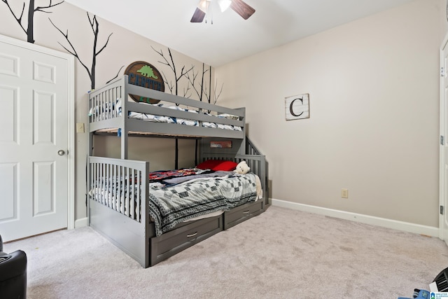 bedroom with carpet flooring, baseboards, and a ceiling fan