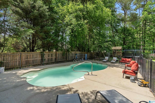 view of pool featuring a fenced backyard and a patio area