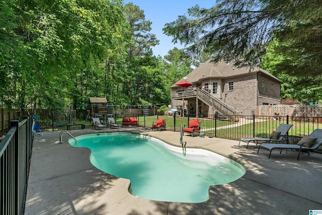 view of swimming pool featuring stairs and a patio area