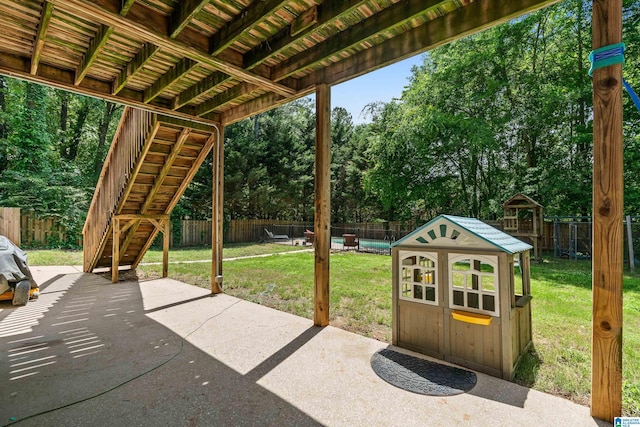 view of patio / terrace with view of scattered trees and stairway