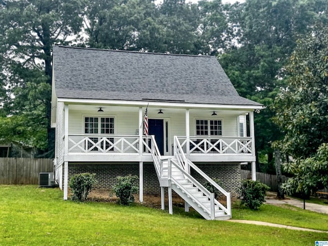 20443 Hepzibah Church Rd, Mccalla, AL 35111 - view of front facade with a porch, a ceiling fan, central AC, fence, and a front lawn