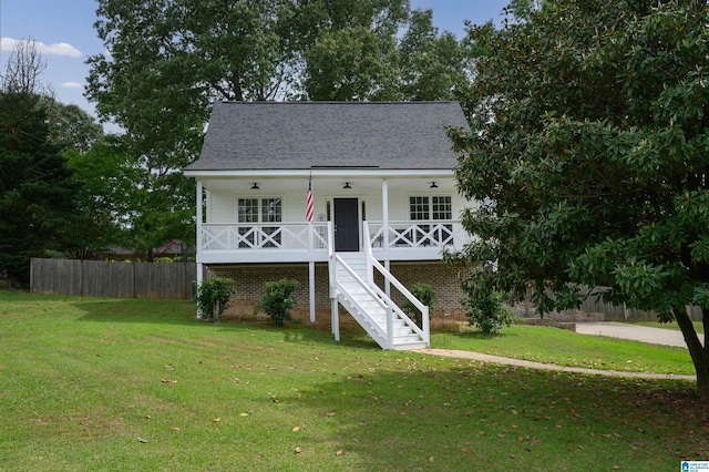 20443 Hepzibah Church Rd, Mccalla, AL 35111 - coastal inspired home with fence, covered porch, a front yard, roof with shingles, and stairway