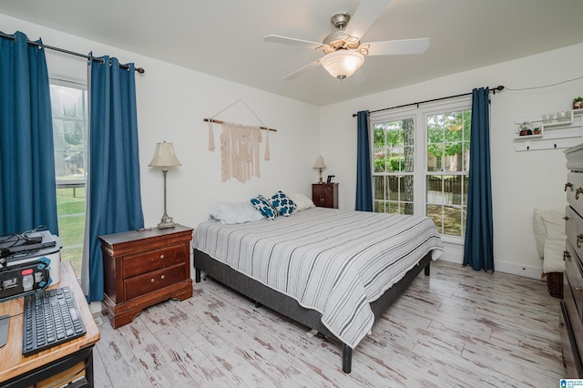 20443 Hepzibah Church Rd, Mccalla, AL 35111 - bedroom featuring a ceiling fan, baseboards, and light wood-style flooring