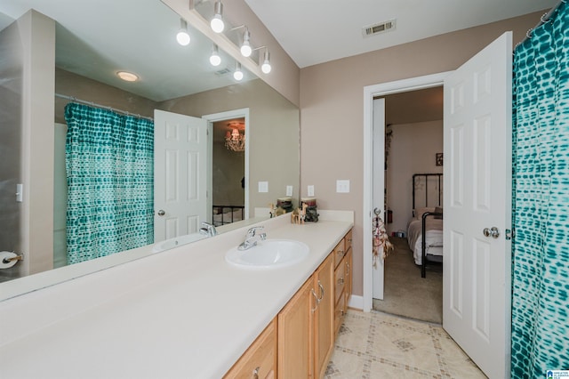 20443 Hepzibah Church Rd, Mccalla, AL 35111 - ensuite bathroom with visible vents, tile patterned flooring, vanity, ensuite bathroom, and a shower with curtain