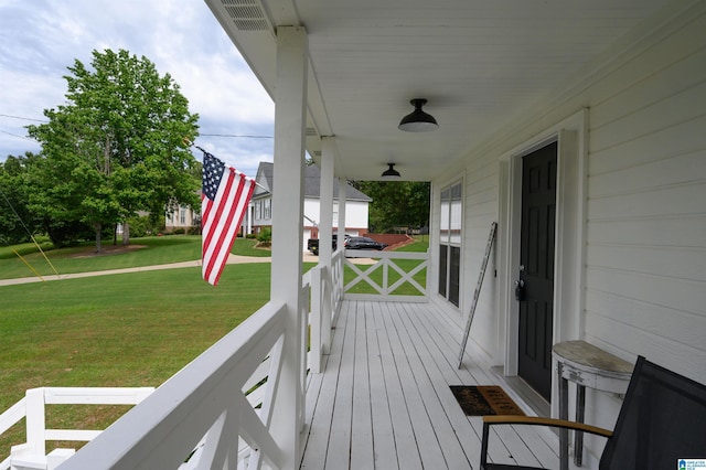 20443 Hepzibah Church Rd, Mccalla, AL 35111 - wooden deck with a lawn, covered porch, and visible vents