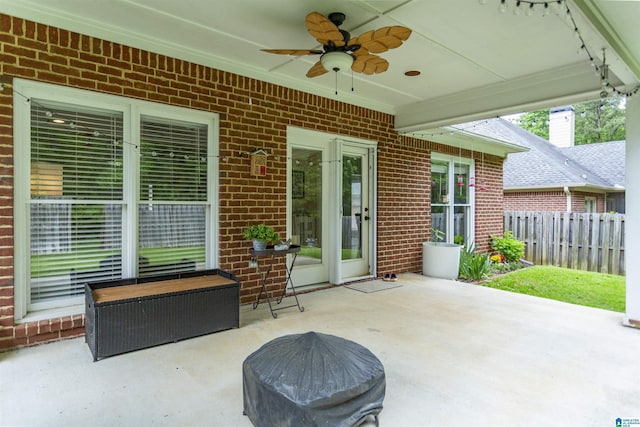 view of patio / terrace featuring fence and a ceiling fan