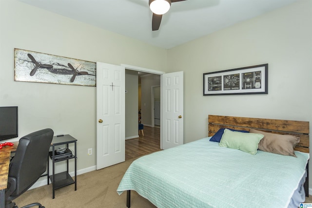 carpeted bedroom with baseboards and a ceiling fan