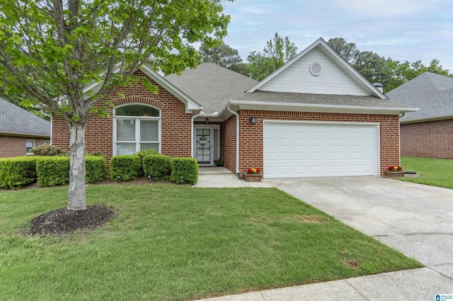 ranch-style home featuring a garage, a front yard, roof with shingles, brick siding, and driveway